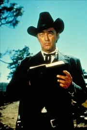Der schie&szlig;w&uuml;tige Prediger Jonathan Rudd (Robert Mitchum) stellt sich als der Bruder des ermordeten Falschspielers heraus.