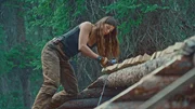 Margot works on her roof before she's gone for the summer.