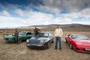 The Top Gear presenters stand with their V8s on a dry lake bed in Argentina.