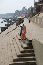 VARANASI, INDIA - Morgan Freeman and Swami Varishthananda walk down a "ghat" or steps down to the Ganges River in Varanasi, India.