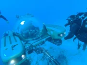 Darrell and his crew next to the submarine Darrell and his crew next to the submarine