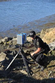 REENACTMENT, MARIN COUNTY ESTUARY, SAN FRANCISCO, CA, USA: LIDAR, a 3-D imaging device, captures a staged crime scene, with actors playing police officers.