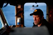 Captain Monte Colburn at the helm for some opies fishing.