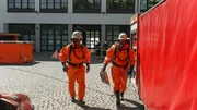 Firefighters in chemical protection suits during a drill Firefighters in chemical protection suits during a drill