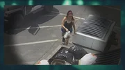 Deborah Culwell throwing bag of puppies into a dumpster