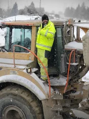 Casey morgan standing on the rock truck covered in snow Casey morgan standing on the rock truck covered in snow