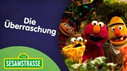 Elin, Elmo und Bert singen ein Lied &uuml;ber &Uuml;berraschungen.