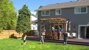 Family playing in backyard