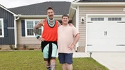 Host David Bromstad (left) poses for a picture with lottery winner Benjamin Haynes (right) outside of House 2, mid pine passage