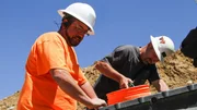Jason Sanchez and Dave Turin run a pan at Box Creek Mine