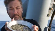 Darrell Miklos showing pyrite in his pan. Darrell Miklos showing pyrite in his pan.