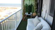 The balcony of Royal Gulf Beach has spectacular views and beautiful greenery, as seen on HGTV's original series, Beachfront Bargain Hunt.