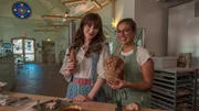 Zooey Deschanel and Stephanie Tantillo, as seen on What Am I Eating? With Zooey Deschanel, Season 1. (posing)