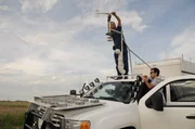 Tim Samaras working on the anemometer; Matt standing near by. Tim Samaras working on the anemometer; Matt standing near by.