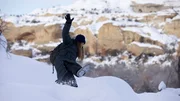 Jess Chabot takes a spill in the snow while investigating skin walkers in the Uinta Basin