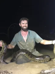 Forrest Galante Sitting In The Mud With The Anaconda