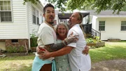 FROM LEFT TO RIGHT: HOST DAVID BROMSTAD POSE FOR A PICTURE WITH  LOTTERY WINNERS DEBORAH AND JOHN TEAGUE OUTSIDE OF HOUSE 3, BOTTLEBRUSH BAY