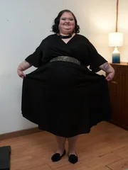 LS Amy posing for her family to show off her weight loss following the surgery.
