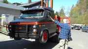 American GMC Vandura on a forklift.