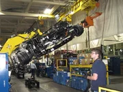 The roll-over machine can lift thousands of pounds and match the speed of the assembly line. The roll-over machine can lift thousands of pounds and match the speed of the assembly line.
