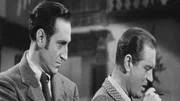 Sherlock Holmes (Basil Rathbone, l.)