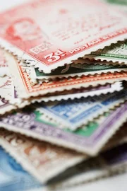 Pile of Postage Stamps --- Image by c moodboard/Corbis