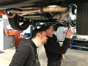 Workshop - mechanics work on the gear.