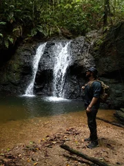 Forrest Galante Standing By A Waterfall Looking Off