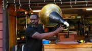 Kayland Brock with phonograph that he found in the garage Kayland Brock with phonograph that he found in the garage