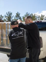 Taking the dentist tank off the truck.