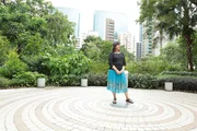 Discovery Bay, Hong Kong - Anita Moorjani stands outside of her home in Discovery Bay and recalls her near-death experience (NDE). Discovery Bay, Hong Kong - Anita Moorjani stands outside of her home in Discovery Bay and recalls her near-death experience (NDE).