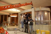 The team puts the inserts inside the tank.