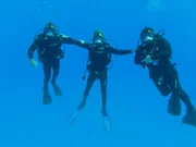 Darrell Miklos, Jim Sinclair, and Eric Schmitt celebrating in the water after gold coin discovery. Darrell Miklos, Jim Sinclair, and Eric Schmitt celebrating in the water after gold coin discovery.