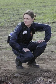 BONES: Brennan (Emily Deschanel) and Booth investigate remains that have been found in an open field in the BONES episode "Spaceman in a Crater". BONES: Brennan (Emily Deschanel) and Booth investigate remains that have been found in an open field in the BONES episode "Spaceman in a Crater".