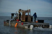 Zeke Tenhoff and Emily Riedel on a dredge. Zeke Tenhoff and Emily Riedel on a dredge.