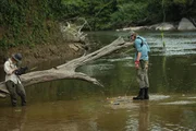 (Left to right) Karla Ann filming Parker Schnabel while he fishes in the Rewa River, Guyana.