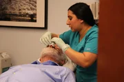 A medical assistant examining David&sbquo;&Auml;&ocirc;s nose.