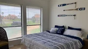 The large windows and vaulted ceilings help to open up the space in the master bedroom at Matagorda Dunes, as seen on HGTV's Beachfront Bargain Hunt. The large windows and vaulted ceilings help to open up the space in the master bedroom at Matagorda Dunes, as seen on HGTV's Beachfront Bargain Hunt.