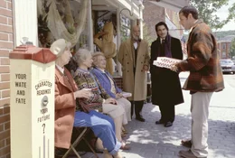 L-R: Jane (Florence Anglin), Kitty (Elizabeth Owens), Sue (Sylvia Kauders), Cecil Anderson (Erick Avari), Chuck Cedar (Peter Gallagher), Longfellow Deeds (Adam Sandler)