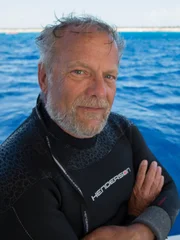 Close-up of Jim Sinclair on boat in swim gear. Close-up of Jim Sinclair on boat in swim gear.