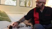 Jackson Galaxy with Izzy the cat. Jackson Galaxy with Izzy the cat.