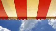 Awning over bright sunny blue sky