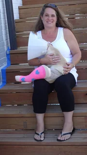 Jeana Stawniak and her pet dog Reya sit outside of Planned Pethood Plus after receiving treatment.