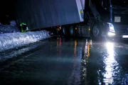 Overhalla, Norway - Slippery and icy road. Truck in the ditch.