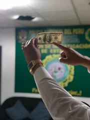 Lima, Peru - Inspecting a money. (National Geographic)