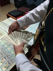 Lima, Peru - A colonel counting money. (National Geographic/Muck Media)