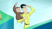 Picture shows Curious George on a mans right arm. Picture shows Curious George on a mans right arm.