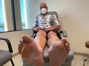 Richard Tuberville with Feet on edge of exam bed Richard Tuberville with Feet on edge of exam bed