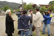 Sam Donladson and the camera crew (played by Eduardo Ribas) rush to get into place to meet Erich Priebke, nazi war criminal