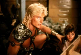 L-R: He-Man (Dolph Lundgren), Julie Winston  (Courteney Cox)